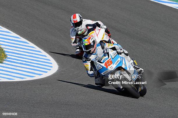 Alex De Angelis of San Marino and Scot Racing Team leads Joan Olive of Spain and Jack and Jones by A. Banderas during the second day of test at...