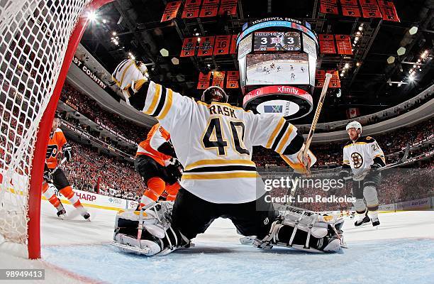 Tuukka Rask and Andrew Ference of the Boston Bruins stop a scoring attempt by Claude Giroux and Scott Hartnell of the Philadelphia Flyers with 10:58...