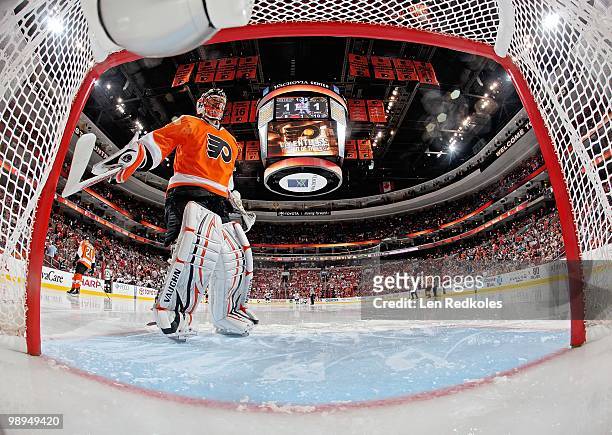 Brian Boucher of the Philadelphia Flyers taps the goal post with 1:25 remaining in the first intermission prior to the start of the second period...