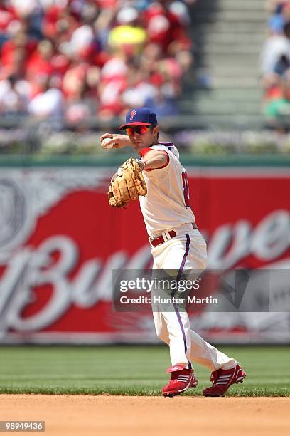 Second baseman Chase Utley of the Philadelphia Phillies throws to first base during a game against the St. Louis Cardinals at Citizens Bank Park on...