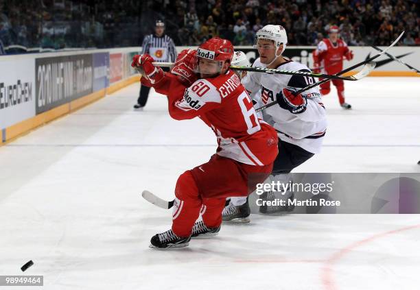 Galiardi of USA and Mads Christensen of Denmark battle for the puck during the IIHF World Championship group A match between USA and Denmark at...