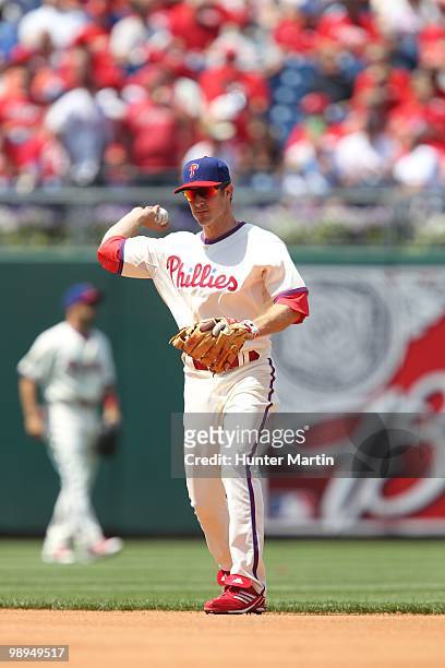 Second baseman Chase Utley of the Philadelphia Phillies throws to first base during a game against the St. Louis Cardinals at Citizens Bank Park on...