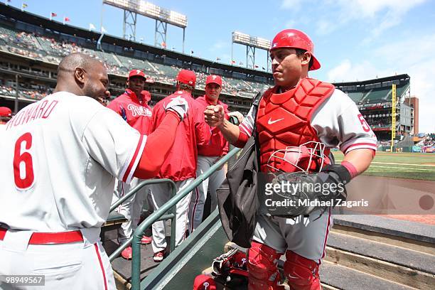 Ryan Howard and Carlos Ruiz of the Philadelphia Phillies standing in the dugout prior to the game against the San Francisco Giants at AT&T Park on...