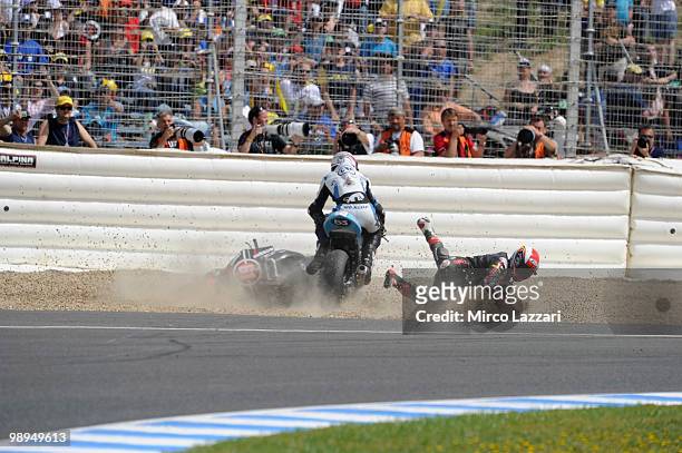 Vladimir Ivanov of Russia and Gresini Racing Moto2 and Valentin Debise of French and WTR San Marino Team crashed out during the Moto2 race at...