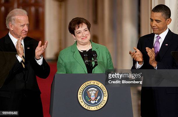 Elena Kagan, U.S. Solicitor general, center, smiles after being introduced by U.S. President Barack Obama, right, in the East Room of the White House...