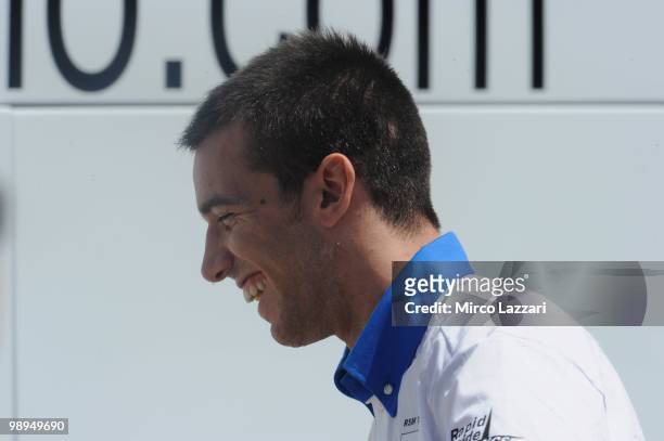 Alex De Angelis of San Marino and Scot Racing Team smiles in paddock during the second day of test at Circuito de Jerez on May 1, 2010 in Jerez de la...