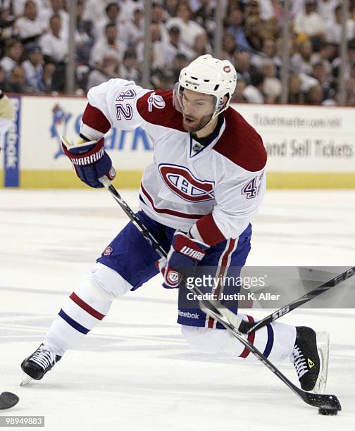 Dominic Moore of the Montreal Canadiens takes a shot on goal against the Pittsburgh Penguins in Game Five of the Eastern Conference Semifinals during...