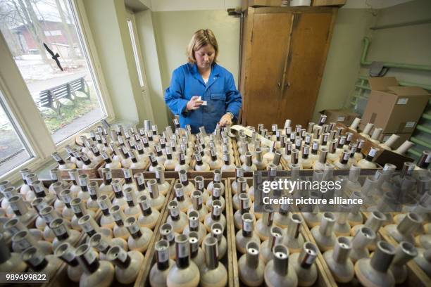 An employee of the fireworks manufacturer Zink Feuerwerk GmbH labels fireworks in Cleebronn, Germany, 19 December 2017. The fireworks are still...