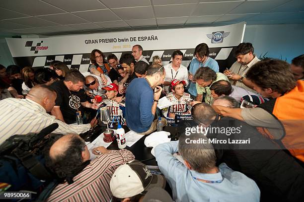 Valentino Rossi of Italy and Jorge Lorenzo of Spain and Fiat Yamaha Team speak with journalists after the press conference after the MotoGP race at...