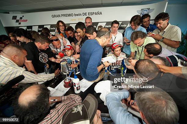 Valentino Rossi of Italy and Jorge Lorenzo of Spain and Fiat Yamaha Team speak with journalists after the press conference after the MotoGP race at...