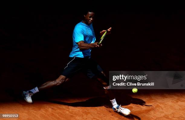 Gael Monfils of France plays a forehand against Stephane Robert of France in their first round match during the Mutua Madrilena Madrid Open tennis...