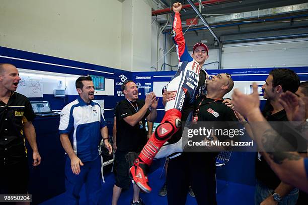 Jorge Lorenzo of Spain and Fiat Yamaha Team celebrates in box with the team after the MotoGP race at Circuito de Jerez on May 2, 2010 in Jerez de la...