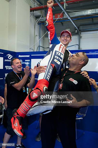 Jorge Lorenzo of Spain and Fiat Yamaha Team celebrates in box with the team after the MotoGP race at Circuito de Jerez on May 2, 2010 in Jerez de la...
