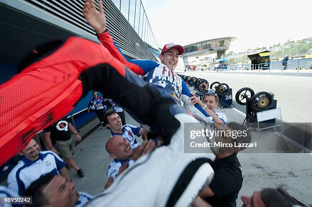 Jorge Lorenzo of Spain and Fiat Yamaha Team celebrates in box with the team after the MotoGP race at Circuito de Jerez on May 2, 2010 in Jerez de la...