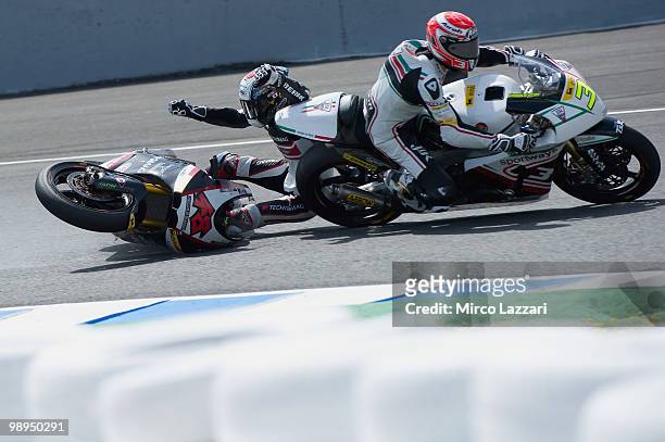 Shoya Tomizawa of Japan and Technomag - CIP crashed out and start of the group of Moto2 riders' crash during the Moto2 race at Circuito de Jerez on...