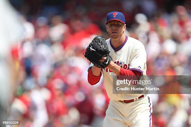 Starting pitcher Roy Halladay of the Philadelphia Phillies looks back a runner during a game against the St. Louis Cardinals at Citizens Bank Park on...