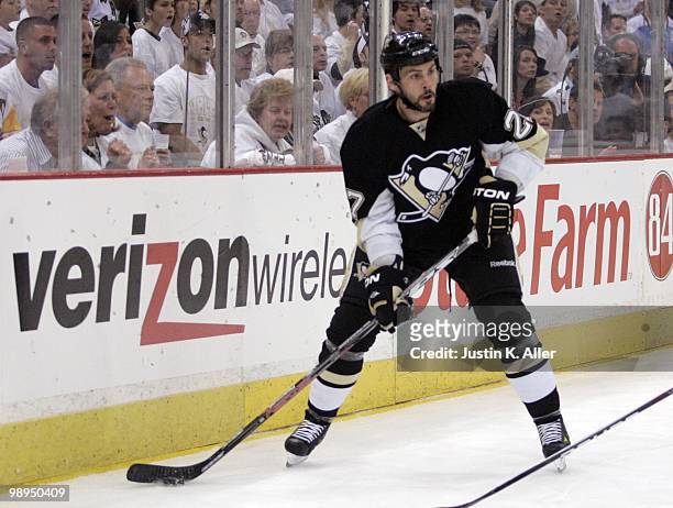 Craig Adams of the Pittsburgh Penguins handles the puck against the Montreal Canadiens in Game Five of the Eastern Conference Semifinals during the...