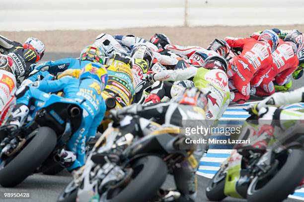The MotoGP riders rounds the bend at the first corner of first lap during the MotoGP race at Circuito de Jerez on May 2, 2010 in Jerez de la...