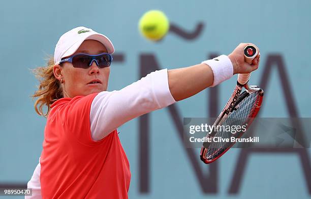 Samantha Stosur of Australia plays a backhand against Gisela Dulko of Argentina in their first round match during the Mutua Madrilena Madrid Open...