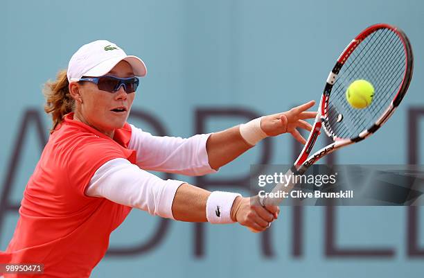 Samantha Stosur of Australia plays a backhand against Gisela Dulko of Argentina in their first round match during the Mutua Madrilena Madrid Open...