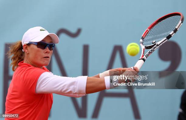 Samantha Stosur of Australia plays a backhand against Gisela Dulko of Argentina in their first round match during the Mutua Madrilena Madrid Open...