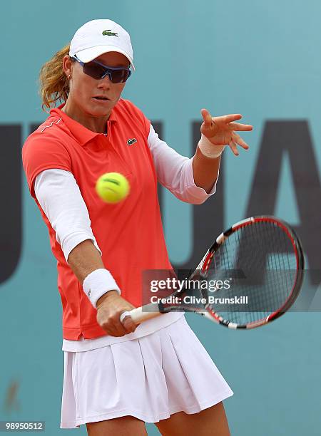 Samantha Stosur of Australia plays a backhand against Gisela Dulko of Argentina in their first round match during the Mutua Madrilena Madrid Open...