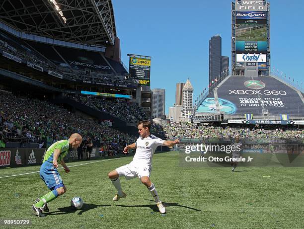 Freddie Ljungberg of the Seattle Sounders FC battles Todd Dunivant of the Los Angeles Galaxy on May 8, 2010 at Qwest Field in Seattle, Washington.