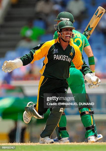 Pakistani wicketkeeper Kamran Akmal celebrates after stumping South African batsman Johan Botha during the ICC World Twenty20 Super Eight match...