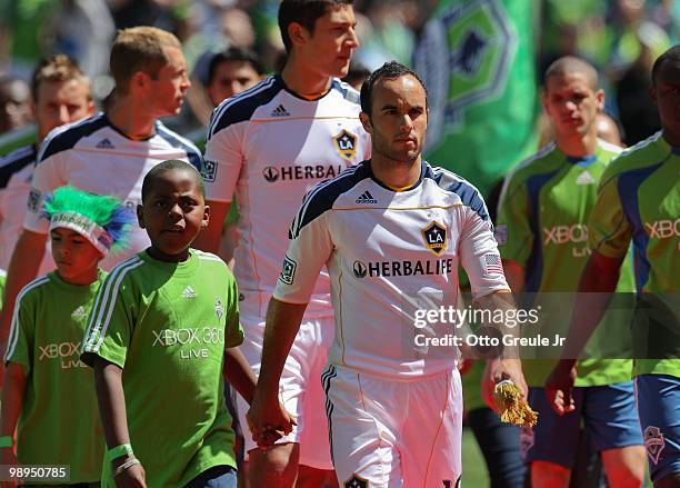 Landon Donovan of the Los Angeles Galaxy takes the field during pre-game ceremonies against the Seattle Sounders FC on May 8, 2010 at Qwest Field in...