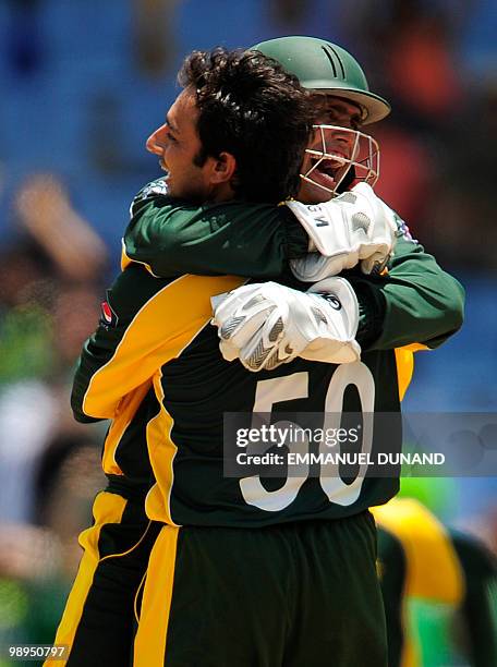 Pakistani wicketkeeper Kamran Akmal and bowler Saeed Ajmal celebrate after stumping South African batsman Johan Botha during the ICC World Twenty20...