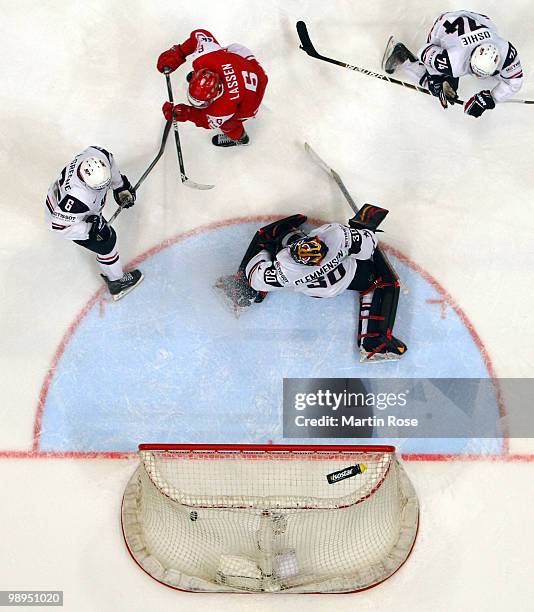 Stefan Lassen of Denmark scores his team's winning goal during overtime during the IIHF World Championship group A match between USA and Denmark at...