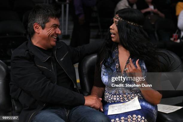 Actor/comedian George Lopez talks with Pam Bryant, the mother of Kobe Bryant of the Los Angeles Lakers, before Game Two of the Western Conference...