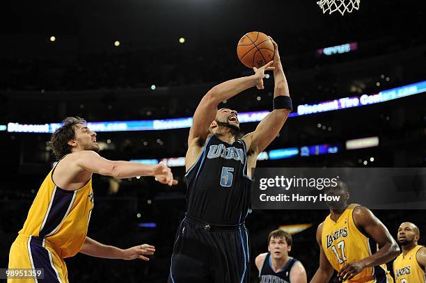 Carlos Boozer of the Utah Jazz goes to the basket against Pau Gasol of the Los Angeles Lakers during Game Two of the Western Conference Semifinals of...