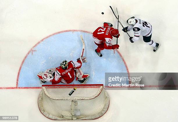 Oshie of USA and Thor Dresler of Denmark battle for the puck during the IIHF World Championship group A match between USA and Denmark at Lanxess...