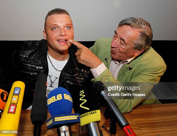 Menowin Froehlich and Richard Lugner joke during a press conference at Lugner City on May 10, 2010 in Vienna, Austria.