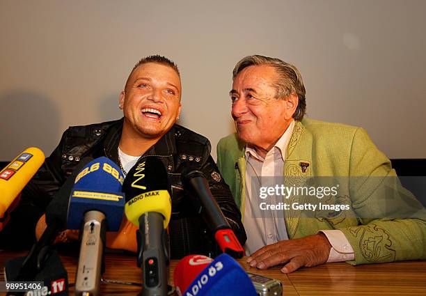 Menowin Froehlich and Richard Lugner joke during a press conference at Lugner City on May 10, 2010 in Vienna, Austria.