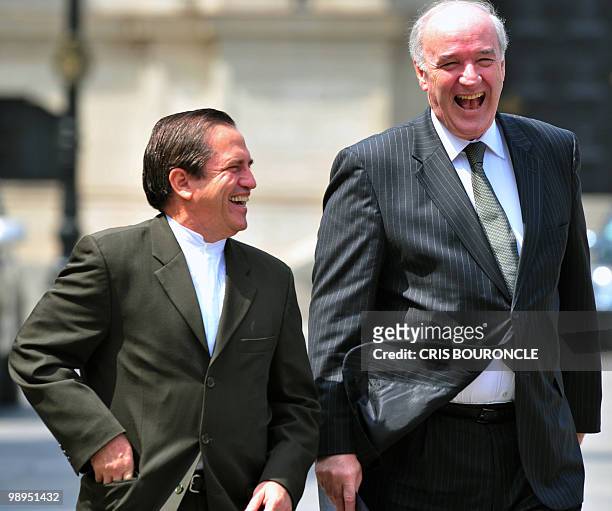 Ecuadorean Foreign Minister Ricardo Patino and his Peruvian counterpart Jose Garcia Belaunde share a laugh after meeting with Peruvian Ppresident...