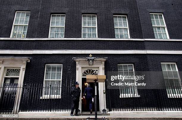 Prime Minister Gordon Brown walks back into number 10 Downing Street after speaking about the current state of Government and announcing that he will...