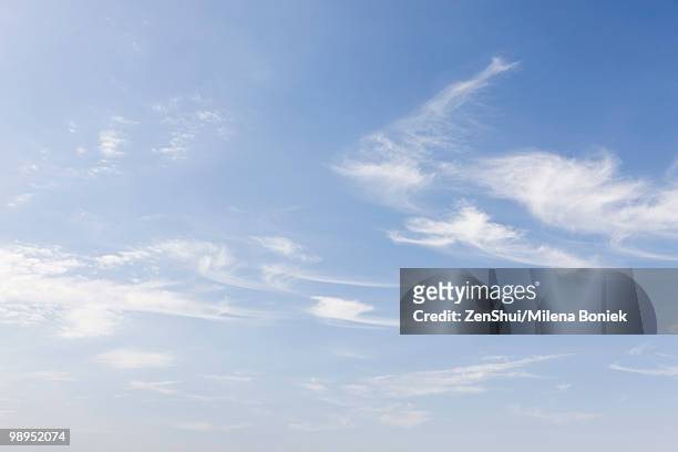 wispy clouds in blue sky - wispy stock pictures, royalty-free photos & images