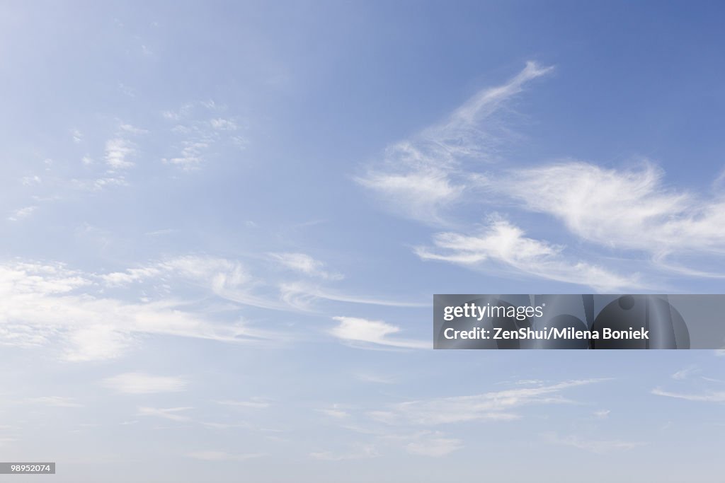 Wispy clouds in blue sky