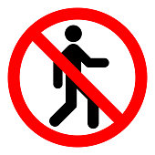 NO ENTRY sign. Strikethrough human silhouette on red circle. Vector icon