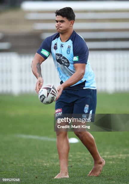 Latrell Mitchell takes part in a drill in bare feet during a New South Wales Blues State of Origin Recovery Session at Coogee Oval on July 2, 2018 in...