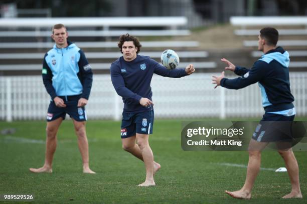 Tom Trbojevic, James Roberts and Nathan Cleary take part in a drill in bare feet during a New South Wales Blues State of Origin Recovery Session at...