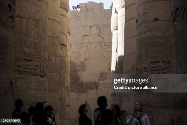 Picture issued on 24 December 2017, shows tourists walking at the hall of columns of the Karnak Temple, in Luxor, Upper Egypt, 08 December 2017....