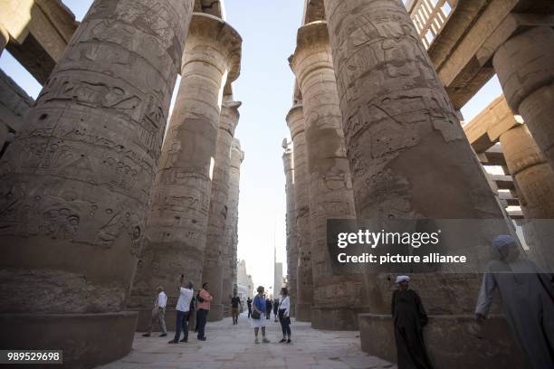 Picture issued on 24 December 2017, shows tourists walking at the hall of columns at the Karnak Temple, in Luxor, Upper Egypt, 08 December 2017....