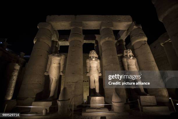 Picture issued on 24 December 2017, shows the illuminated statues during a light show at the Luxor Temple in Luxor, Upper Egypt, 10 December 2017....