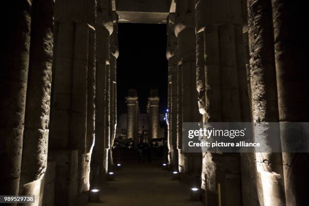 Picture issued on 24 December 2017, shows the illuminated processional Colonnade of Amenhotep III during a light show at the Luxor Temple in Luxor,...
