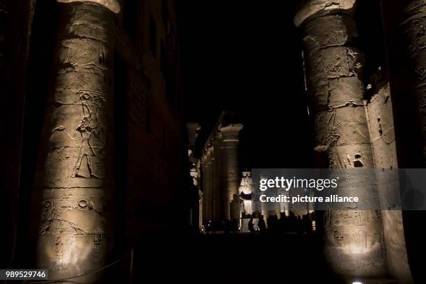 Picture issued on 24 December 2017, shows the illuminated statue of Ramsis II through the processional Colonnade of Amenhotep III during a light show...