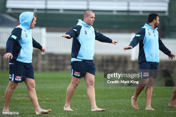 David Klemmer and team mates take part in a drill in bare feet during a New South Wales Blues State of Origin Recovery Session at Coogee Oval on July...