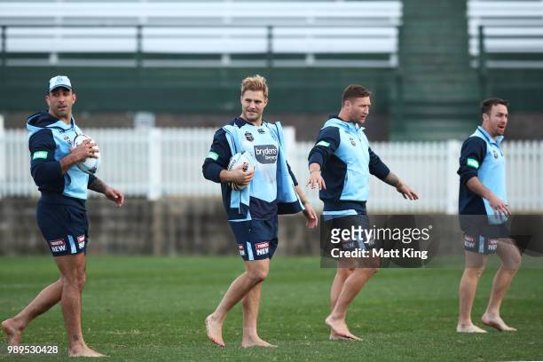 Paul Vaughan, Jack de Belin, Tariq Sims and James Maloney take part in a drill in bare feet during a New South Wales Blues State of Origin Recovery...